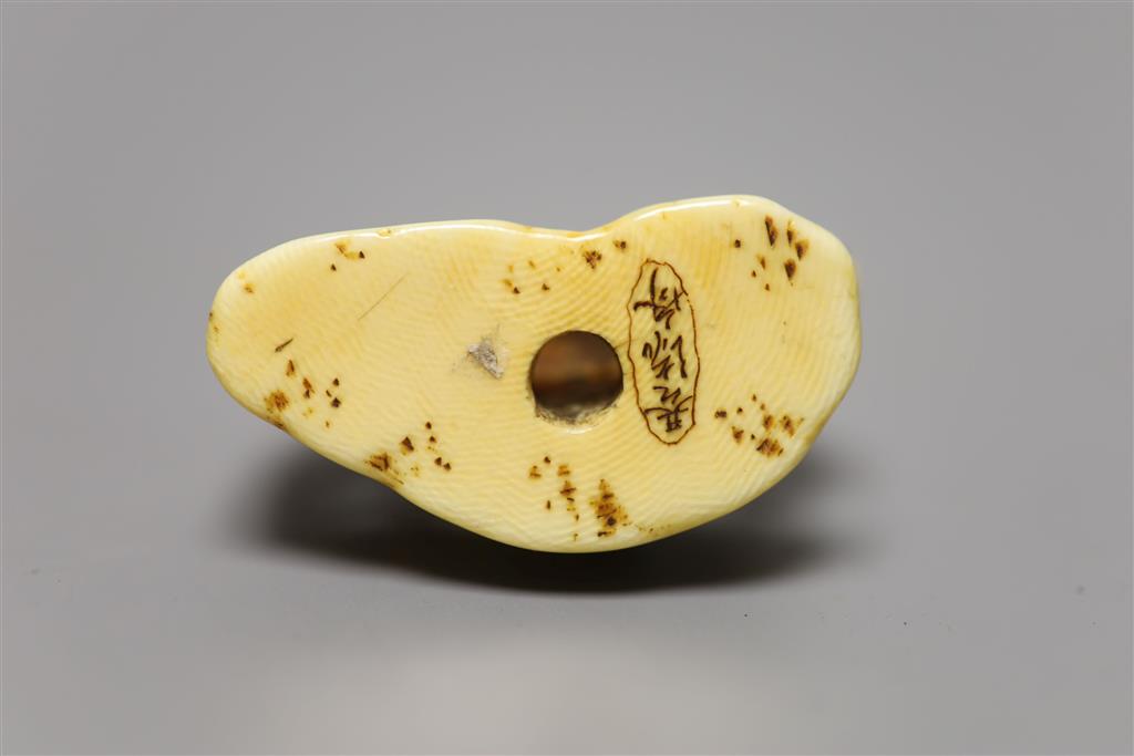 A 19th century ivory netsuke horse group, height 4cm, three character signature
